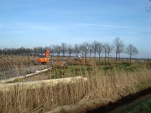 De straat de Vendreef met graafmachines